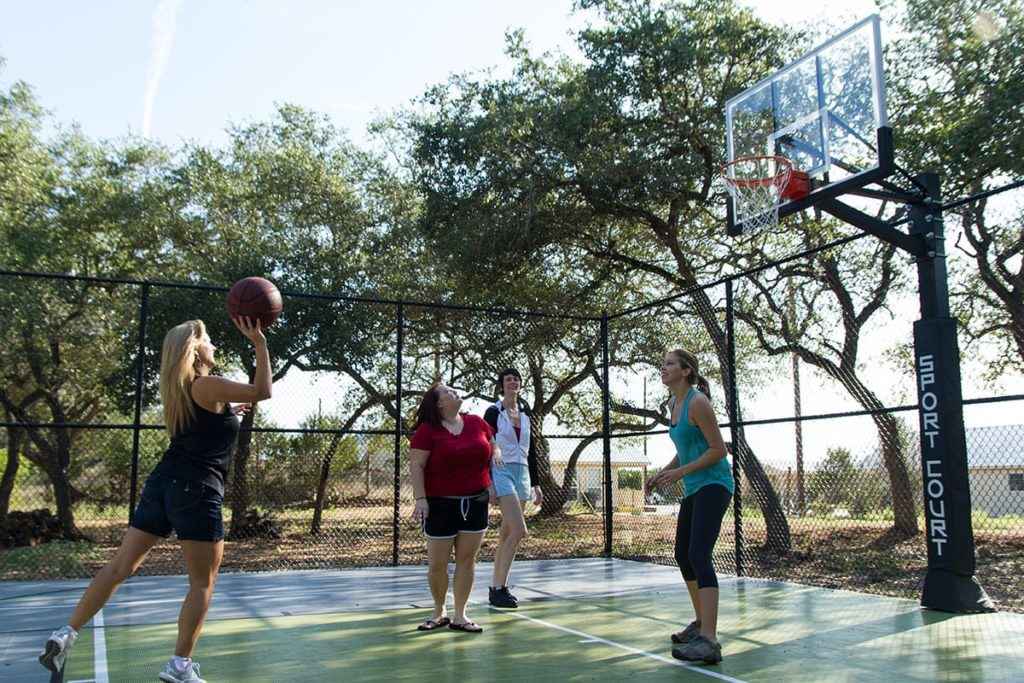 Clients playing basketball at the Right Step Hill Country
