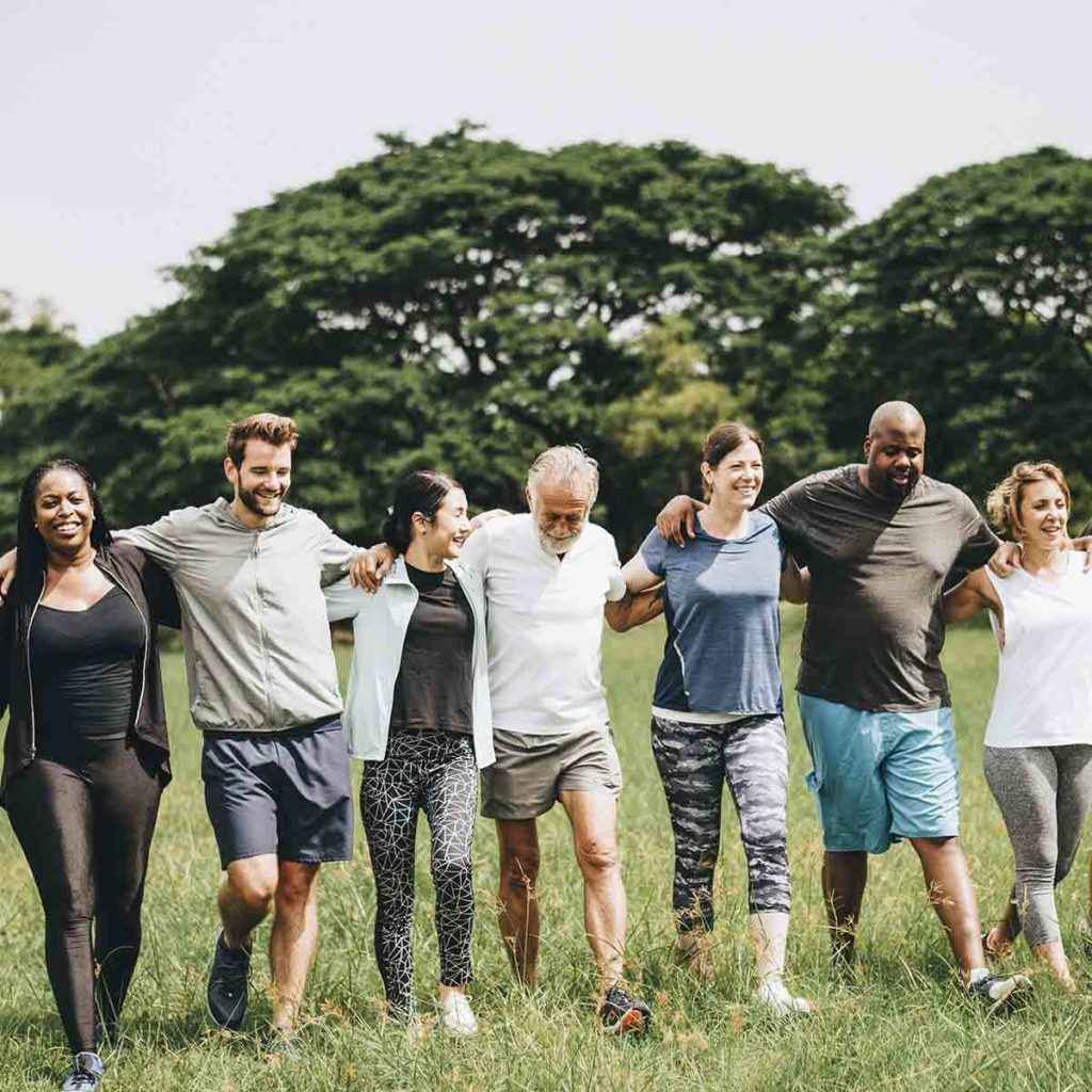 Group of people embrace at The Right Step Hill Country