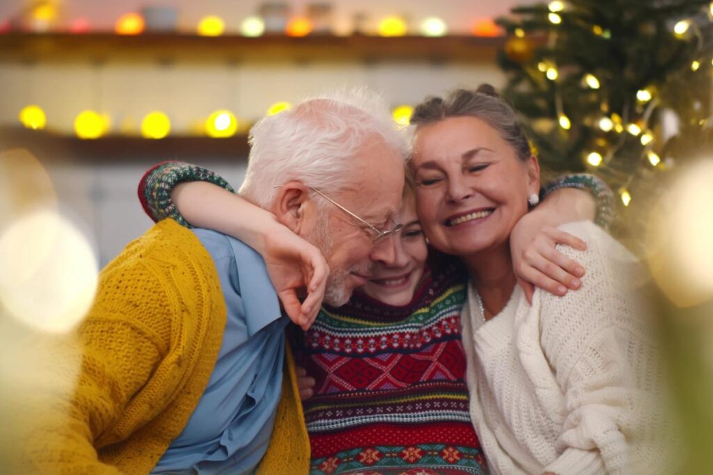 a family hugs by festive lights, a great idea for a sober new year's eve