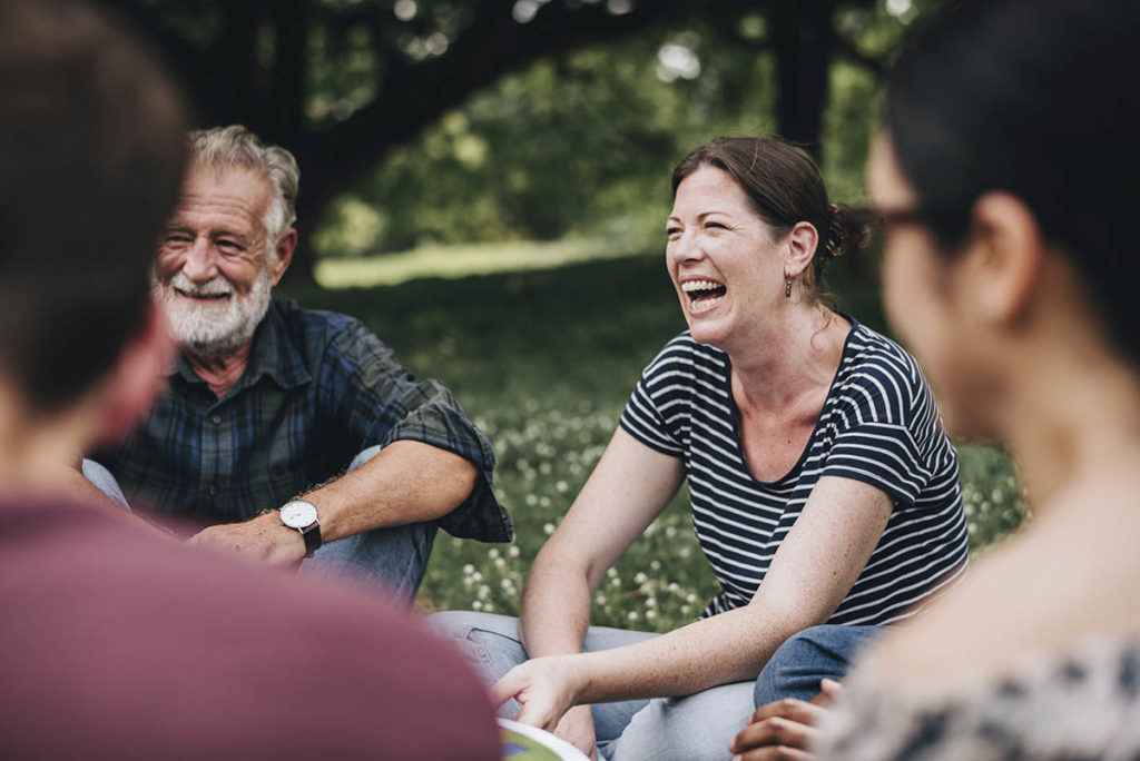 a group therapy session learning about inpatient vs outpatient treatment