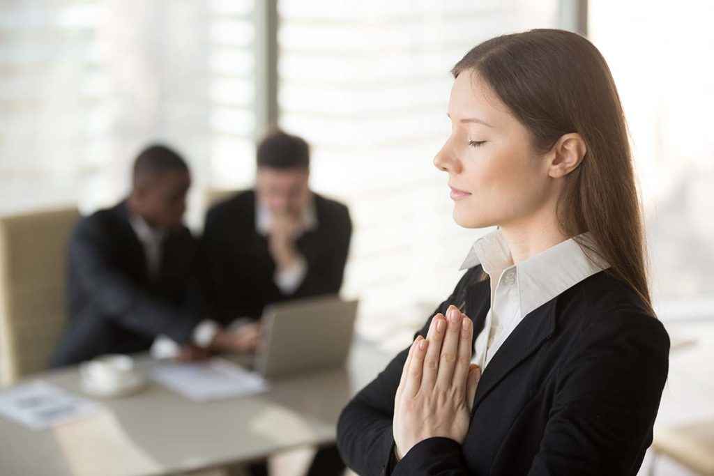 a woman practicing Stress Management Techniques after feeling pressure