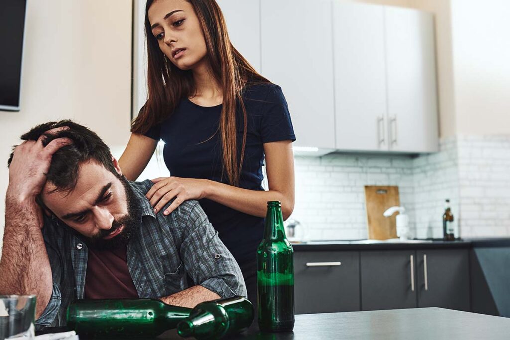 a person consoles another during one of the stages of alcoholism