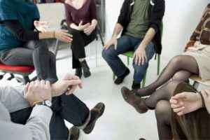 a group therapy session at a mental health treatment center