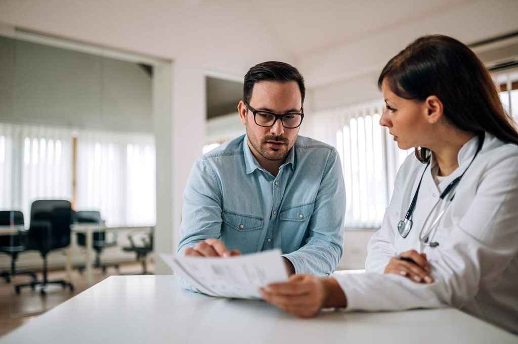 man going over a treatment plan for individualized care