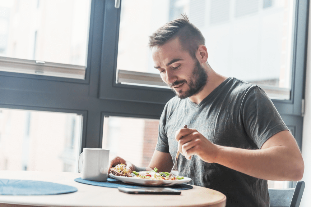 Man eating for nutrition and addiction recovery