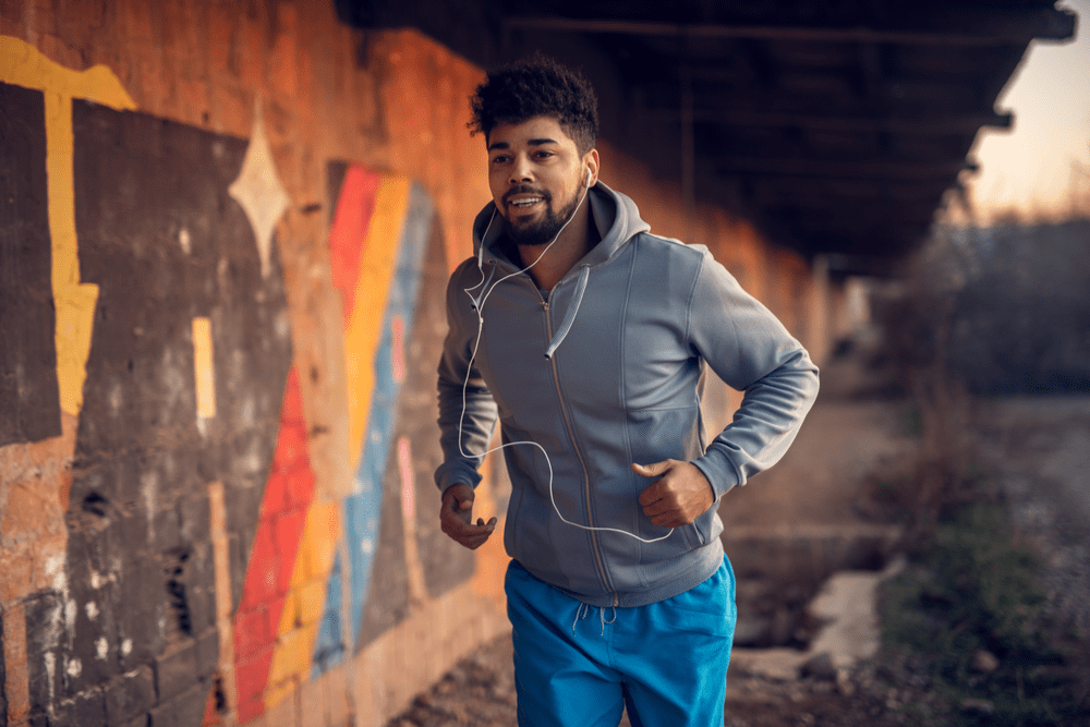 Man running for exercise and alcohol recovery