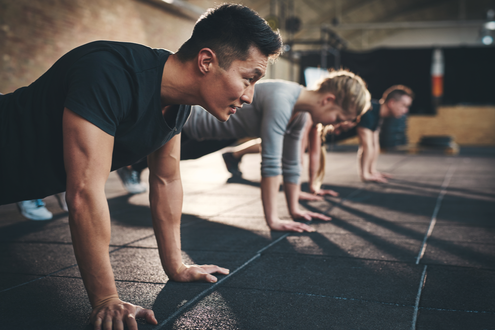 Man in class exercising to help depression and addiction