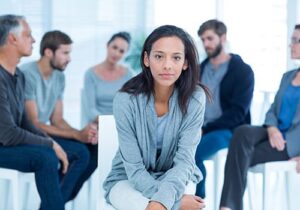 a person in a group in an inpatient rehab center