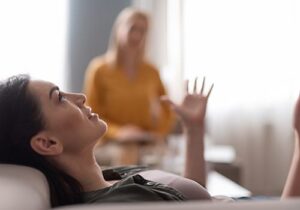 a person talks to a therapist in a mental health treatment center