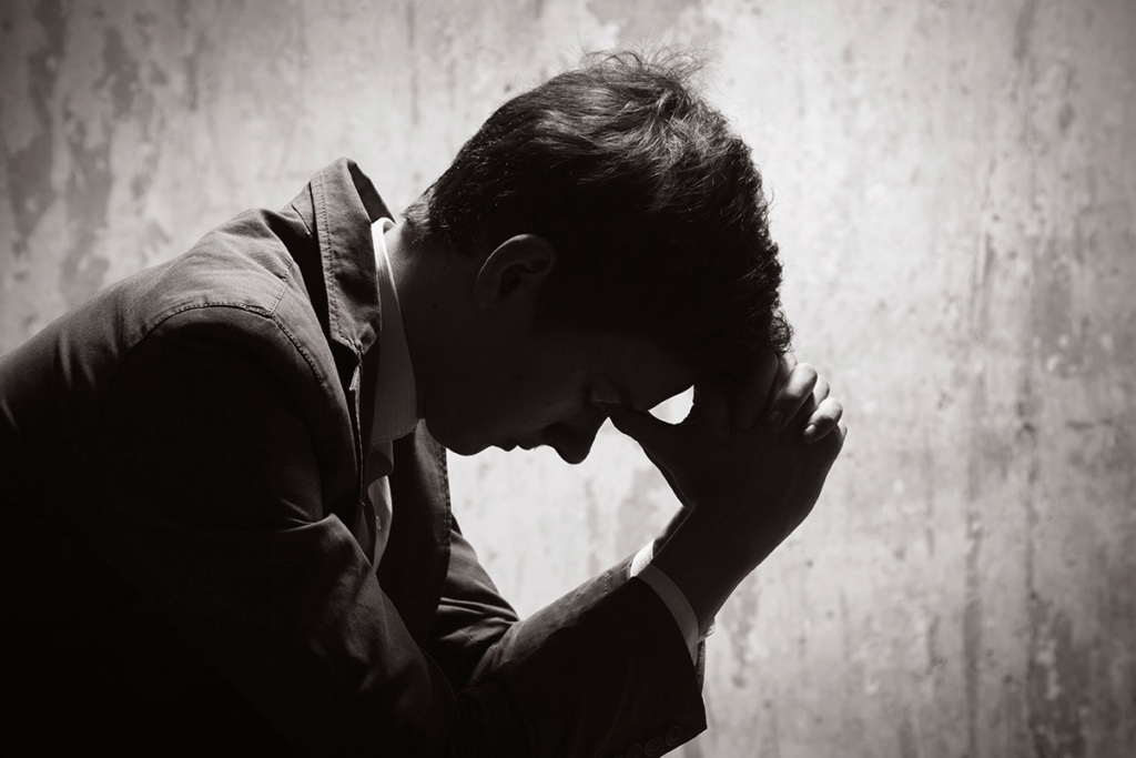 a man struggles through the stages of alcohol withdrawal without professional help