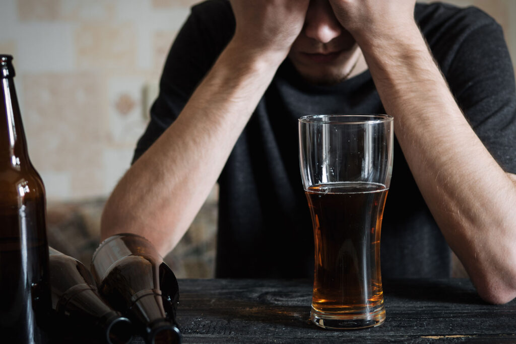 Man experiencing signs of alcohol poisoning