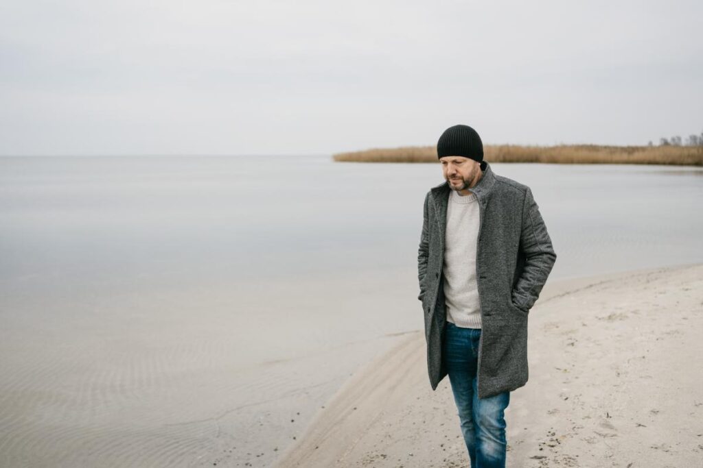 man walks the beach during the winter and asks himself why do drug overdose increase in winter